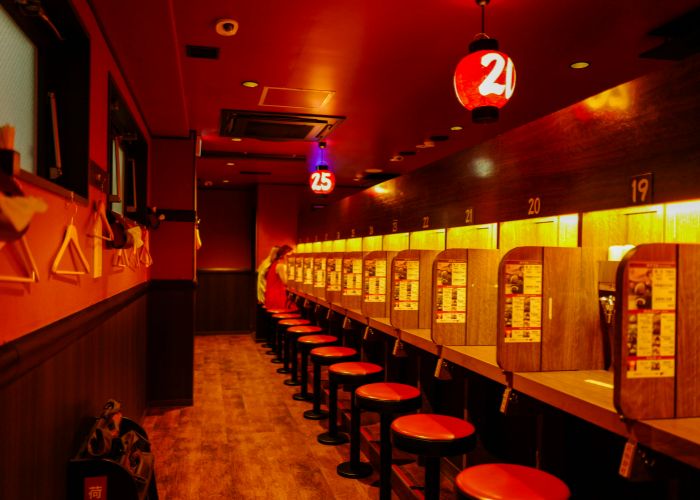 Empty stalls at Ichiran Ramen, a perfect spot for solo diners.